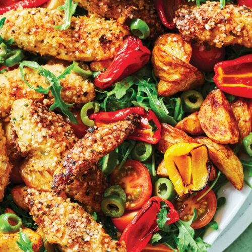 Crumbed chicken with roasted potato, tomato and olive salad